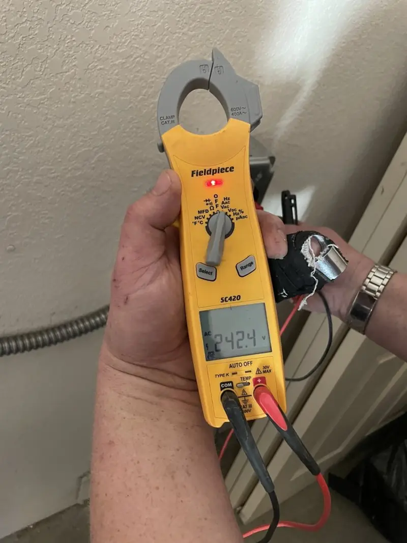 Voltage testing with clamp meter during Recessed Lighting Installation in Sugar Hill